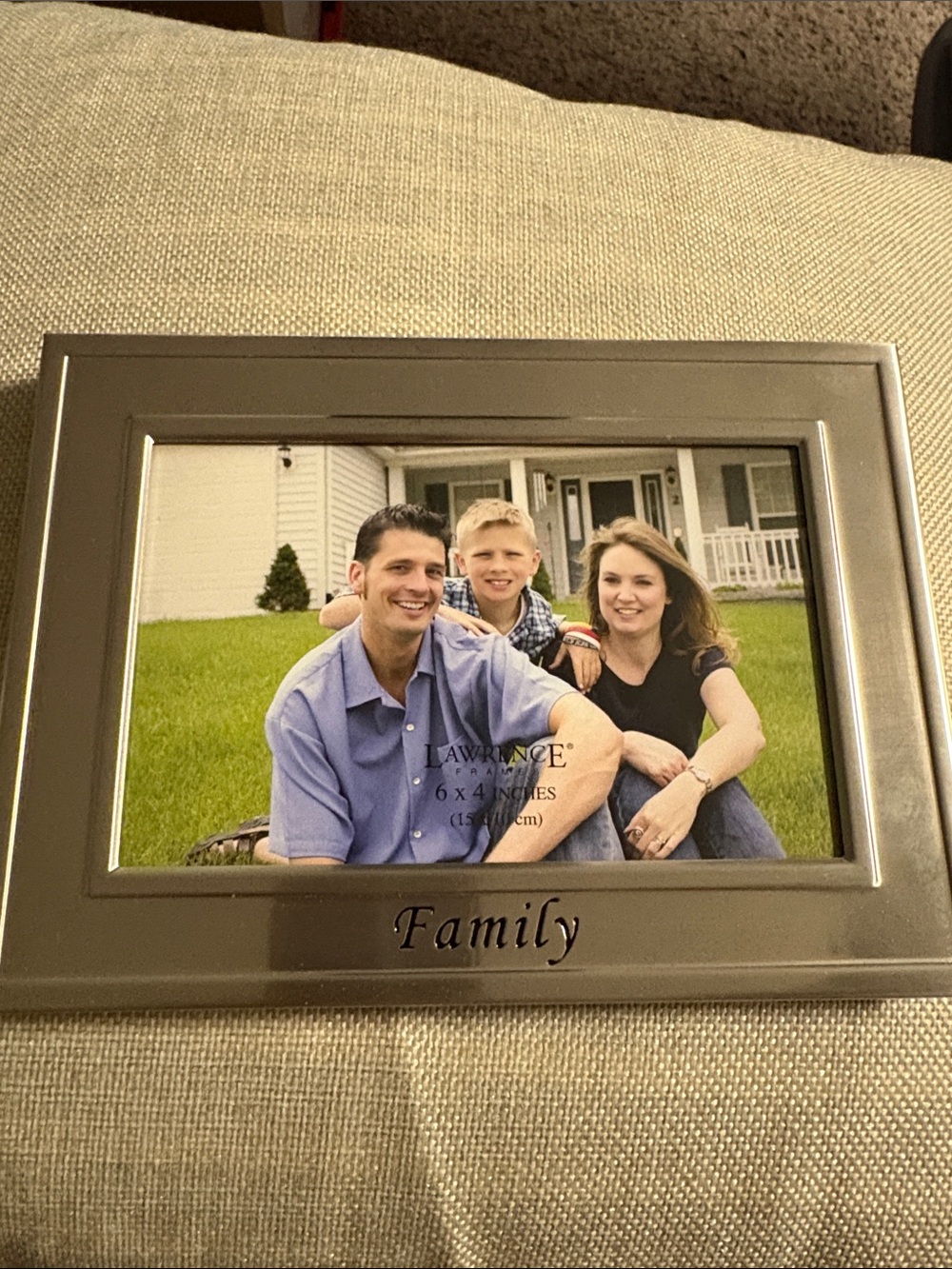 Silver 6X4 Picture Frame with Stand and  FAMILY engraved on bottom front.  NEW